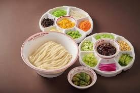Zhajiangmian noodles with sauce and vegetable toppings